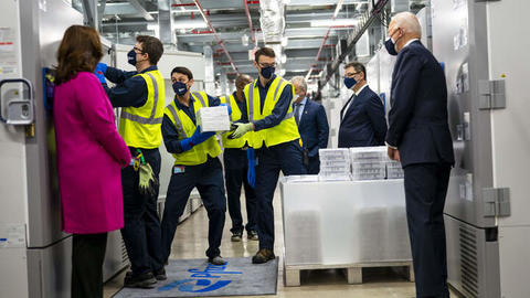 President Biden and Vice President Harris observe Pfizer Covid-19 vaccines being loaded for transport from Kalamazoo